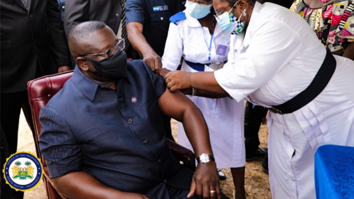 President of Sierra Leone being vaccinated
